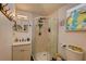 Cozy bathroom featuring a glass enclosed shower, modern sink and artistic decor at 4742 13Th N Ave, St Petersburg, FL 33713