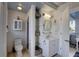 Well-organized bathroom with sink and open shelves, and convenient toilet placement at 4742 13Th N Ave, St Petersburg, FL 33713