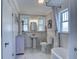 Bathroom with subway tile, pedestal sink, and bathtub with shower and natural light at 4742 13Th N Ave, St Petersburg, FL 33713