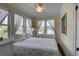 Cozy bedroom with soft natural light, decorative lamp, and comfortable floral-patterned bedding at 4742 13Th N Ave, St Petersburg, FL 33713