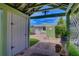 Charming courtyard with a covered walkway, lush landscaping, and a serene atmosphere at 4742 13Th N Ave, St Petersburg, FL 33713