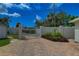 Paved driveway and entry gate with manicured landscaping at 4742 13Th N Ave, St Petersburg, FL 33713