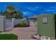 Gated driveway entrance with a lush garden bed and walkway leading to the house at 4742 13Th N Ave, St Petersburg, FL 33713