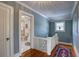 Hallway with an open door to the bathroom and featuring hardwood floors and a decorative rug at 4742 13Th N Ave, St Petersburg, FL 33713