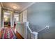 Second floor hallway with hardwood floors and decorative rug runner at 4742 13Th N Ave, St Petersburg, FL 33713