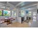 Bright coastal kitchen with light countertops, stainless appliances, eat-in table, and view to landscaped yard at 4742 13Th N Ave, St Petersburg, FL 33713