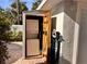 Outdoor laundry area with stacked washer and dryer, and wall-mounted shelving at 4742 13Th N Ave, St Petersburg, FL 33713