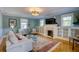 Bright living room features hardwood floors, fireplace with built-ins, and large windows at 4742 13Th N Ave, St Petersburg, FL 33713