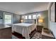Main bedroom features calming color palate, hardwood flooring, and bright, sunny windows at 4742 13Th N Ave, St Petersburg, FL 33713