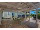Open patio area with table and seating, covered by a bright, white pergola at 4742 13Th N Ave, St Petersburg, FL 33713