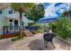 Spacious patio area with a dining table and multiple seating options, under sunny skies at 4742 13Th N Ave, St Petersburg, FL 33713