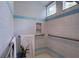 Accessible walk-in shower featuring blue and white tile and grab bars at 4742 13Th N Ave, St Petersburg, FL 33713
