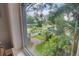 A scenic view from the window, overlooking a well-maintained front yard and lush greenery at 4742 13Th N Ave, St Petersburg, FL 33713