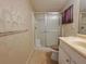 Bathroom featuring a vanity with sink and shower with glass doors, designed for comfort and ease at 4851 W Gandy Blvd # B12L23, Tampa, FL 33611