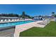Community pool area with lounge chairs and well-maintained grounds at 4851 W Gandy Blvd # B12L23, Tampa, FL 33611