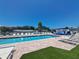 Community pool area with lounge chairs and well-maintained grounds at 4851 W Gandy Blvd # B12L23, Tampa, FL 33611