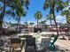 Charming community outdoor area featuring a fire pit, seating and waterfront views at 4851 W Gandy Blvd # B12L23, Tampa, FL 33611