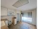 Functional kitchen with dated countertops, white cabinetry and natural light from large windows at 4851 W Gandy Blvd # B12L23, Tampa, FL 33611