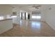 The expansive living room boasts natural light and wood floors leading to other rooms at 4851 W Gandy Blvd # B12L23, Tampa, FL 33611