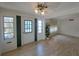 The cozy living room features wood floors, natural light, and neutral walls at 4851 W Gandy Blvd # B12L23, Tampa, FL 33611