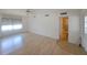 This airy main bedroom features neutral walls and wood floors, connecting to an adjacent bathroom at 4851 W Gandy Blvd # B12L23, Tampa, FL 33611