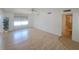 This airy main bedroom features neutral walls and wood floors, connecting to an adjacent bathroom at 4851 W Gandy Blvd # B12L23, Tampa, FL 33611
