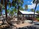 Charming community outdoor pavilion featuring picnic tables, BBQ grill, seating and waterfront views at 4851 W Gandy Blvd # B12L23, Tampa, FL 33611