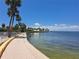 Picturesque waterfront view featuring a paved walkway and serene water views at 4851 W Gandy Blvd # B12L23, Tampa, FL 33611