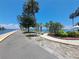 Scenic waterfront walkway featuring a paved path, lush landscaping, and picturesque water views at 4851 W Gandy Blvd # B12L23, Tampa, FL 33611
