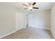 A bright bedroom featuring tile floors and a closet at 4959 Cromey Rd, North Port, FL 34288