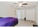 Bedroom with a ceiling fan, tile flooring, and closet at 4959 Cromey Rd, North Port, FL 34288