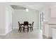 Bright dining area featuring modern lighting and a wooden table, perfect for Gathering meals at 4959 Cromey Rd, North Port, FL 34288