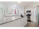 Modern kitchen with granite countertops, stainless steel appliances and sleek, white cabinetry at 4959 Cromey Rd, North Port, FL 34288