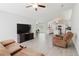Spacious living room featuring comfortable seating and an entertainment area with TV at 4959 Cromey Rd, North Port, FL 34288