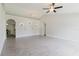 Spacious living room with arched doorways, recessed lighting, ceiling fan, and tile flooring at 4959 Cromey Rd, North Port, FL 34288