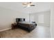 Large bedroom with ceiling fan, tile flooring and ample natural light from two windows at 4959 Cromey Rd, North Port, FL 34288