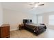 Comfortable bedroom featuring a ceiling fan, tile flooring and a window at 4959 Cromey Rd, North Port, FL 34288