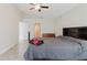 Spacious bedroom with tile flooring, ceiling fan, and arched entryway at 4959 Cromey Rd, North Port, FL 34288