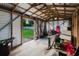 View of the interior of the outbuilding, featuring exposed studs and rafters at 4959 Cromey Rd, North Port, FL 34288