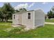Exterior shot of outbuilding with siding, windows and door at 4959 Cromey Rd, North Port, FL 34288