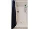 Bright and clean shower stall featuring a blue curtain and wall-mounted storage at 4959 Cromey Rd, North Port, FL 34288