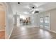 Open-concept layout showcasing the living room, kitchen with a breakfast bar, and dining space all together at 5015 Summer Hill Dr, Zephyrhills, FL 33542