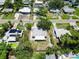 Bird's eye view showing home layouts, solar panels, pools and lush landscaping at 5600 Hobson Ne St, St Petersburg, FL 33703