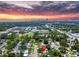 Aerial view of home with a sunset backdrop and downtown St. Petersburg in the distance at 5600 Hobson Ne St, St Petersburg, FL 33703