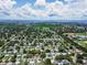 Aerial view showcasing a neighborhood, nearby sports area, and ocean view at 5600 Hobson Ne St, St Petersburg, FL 33703