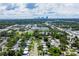 An aerial captures a neighborhood alongside the distant city skyline on the horizon at 5600 Hobson Ne St, St Petersburg, FL 33703