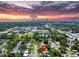 Aerial view of home with a sunset backdrop and downtown St. Petersburg in the distance at 5600 Hobson Ne St, St Petersburg, FL 33703