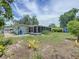 Exterior showing a back yard with enclosed porch and storage shed at 5600 Hobson Ne St, St Petersburg, FL 33703