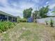 View of backyard, including storage shed and full fence at 5600 Hobson Ne St, St Petersburg, FL 33703