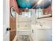 Updated bathroom with a shower-tub combination, new vanity, decorative mirror, and neutral color scheme at 5600 Hobson Ne St, St Petersburg, FL 33703
